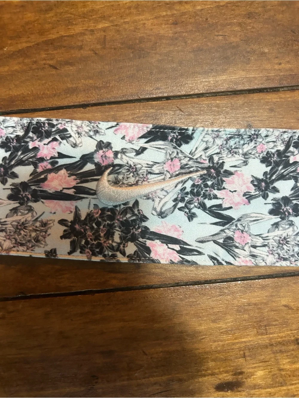 1 Floral blue pink and black Nike headband and 1 orange white and green headband